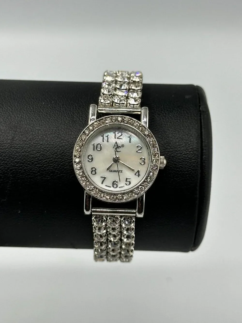 Rhinestone Watch Women Silver Tone Mother of Pearl Dial Stretch New Battery 6.5